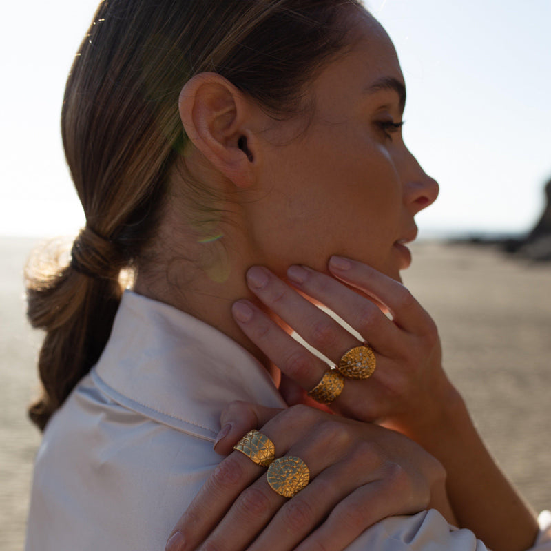 Loren Lewis Cole Jewellery Ancient Inspired Talismanic fairtrade gold rustic unrefined sensual magical storytelling medallion circular shield ring with triangles texture rustic