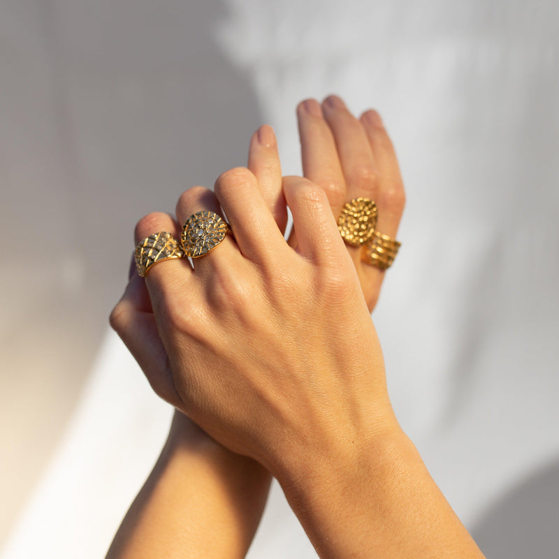 Loren Lewis Cole Jewellery Ancient Inspired Talismanic fairtrade gold rustic unrefined sensual magical storytelling medallion circular shield ring with triangles texture rustic